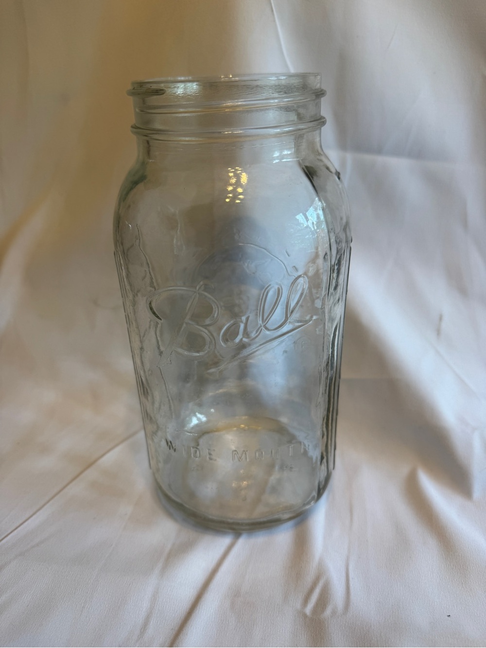 Glass canning jar titled 'Ball Wide Mouth Mason Jar' by Ball Corporation